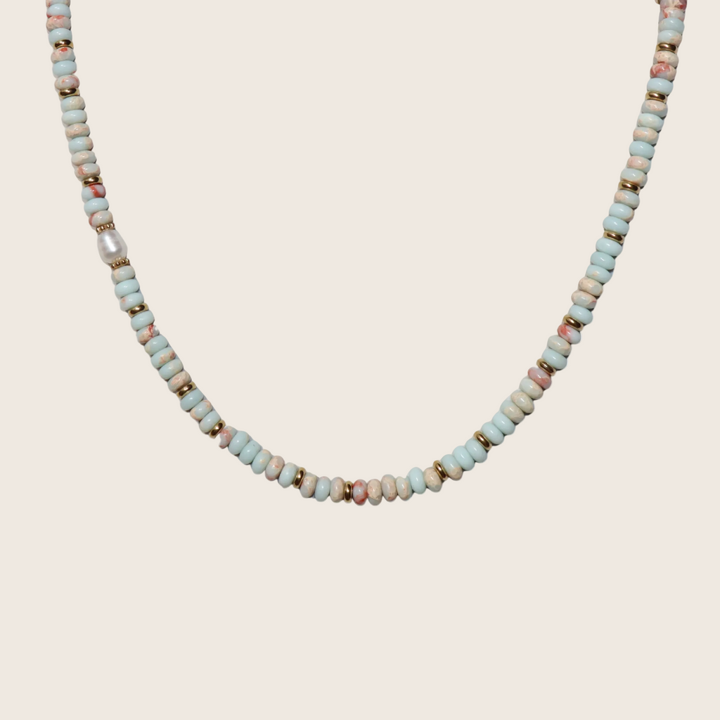 Necklace with small beads on a white background