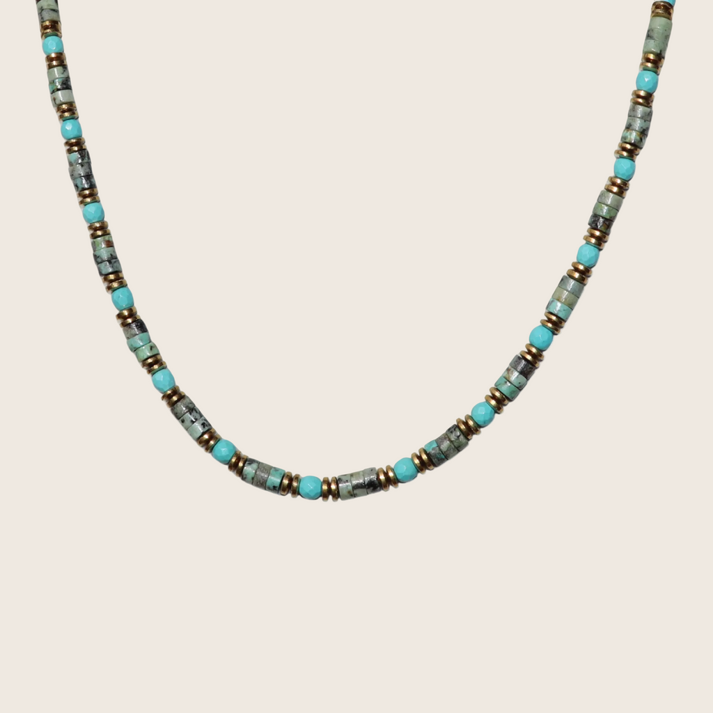 Necklace with turquoise and gray beads on a white background