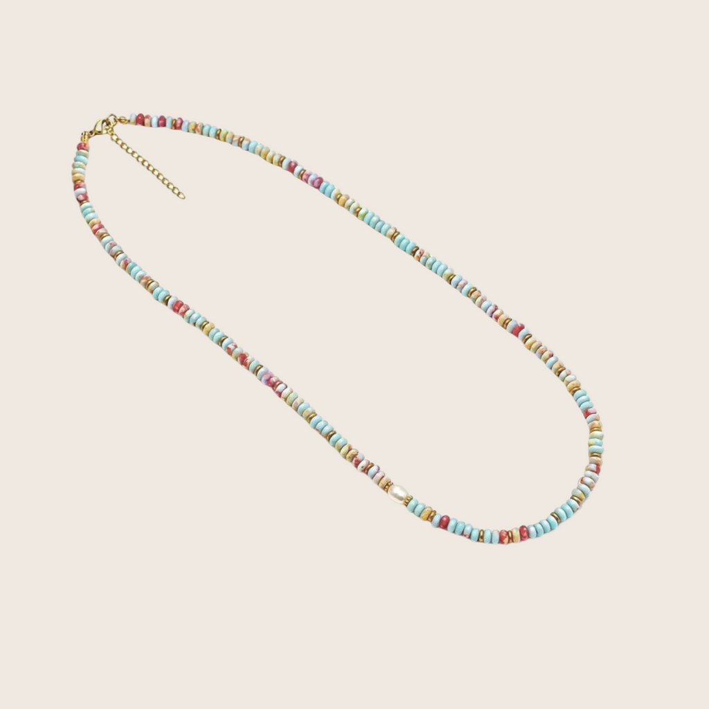 Multicolored beaded necklace on a white background