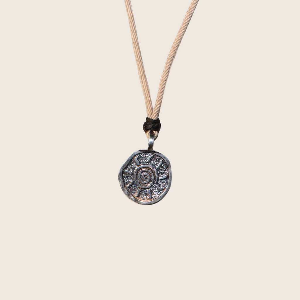 Necklace with a decorative pendant on a white background